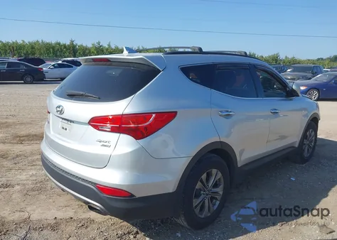 2015 Hyundai Santa Fe Sport 2.4L z USA, uszkodzony, nr VIN 5XYZUDLB7FG277165